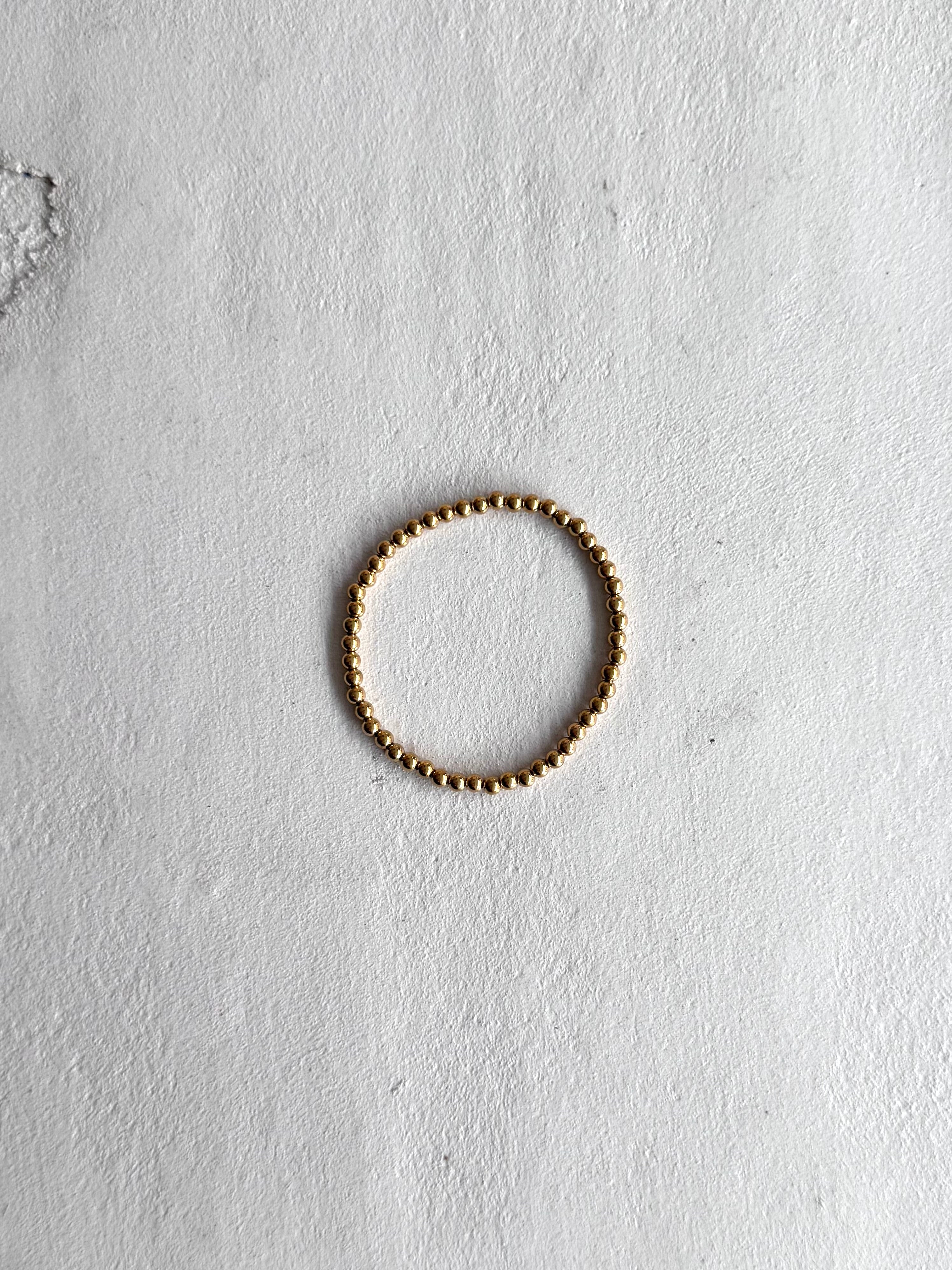 ARMBAND “DOTS” gold